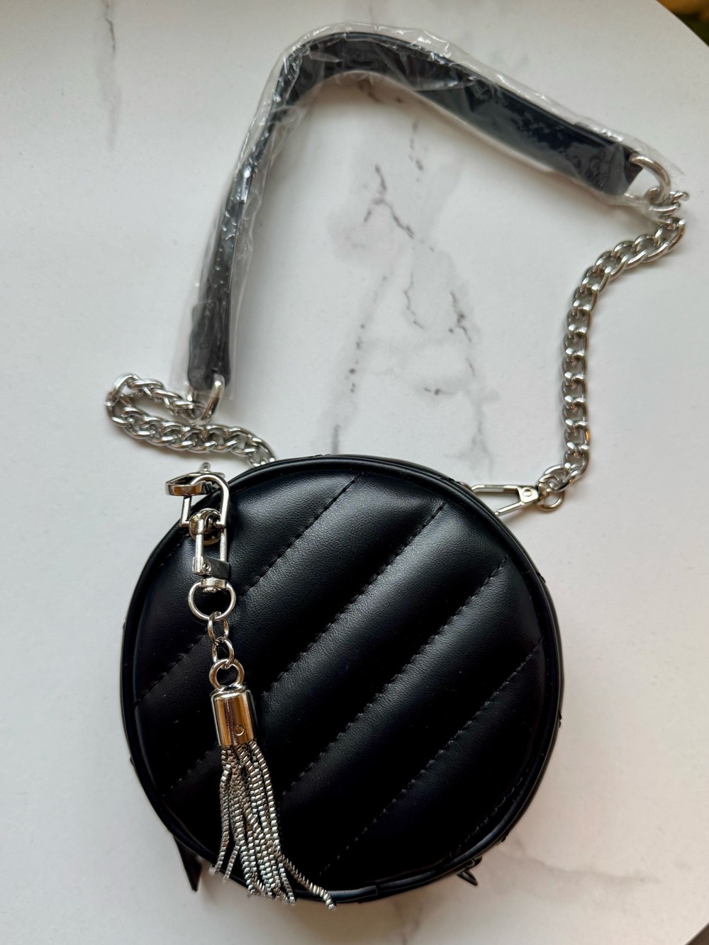 Black Quilted Round Crossbody Bag with Tassel